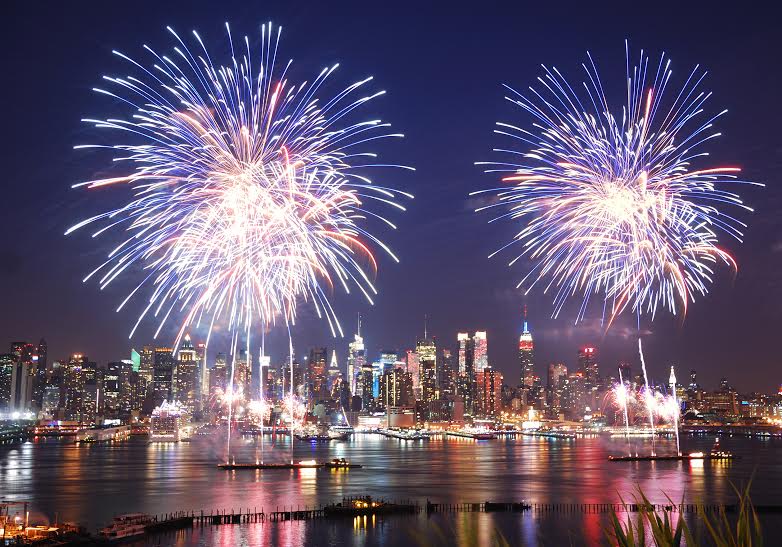 New York City Manhattan July 4th Independence day fireworks show with skyline over Hudson River viewed from New Jersey